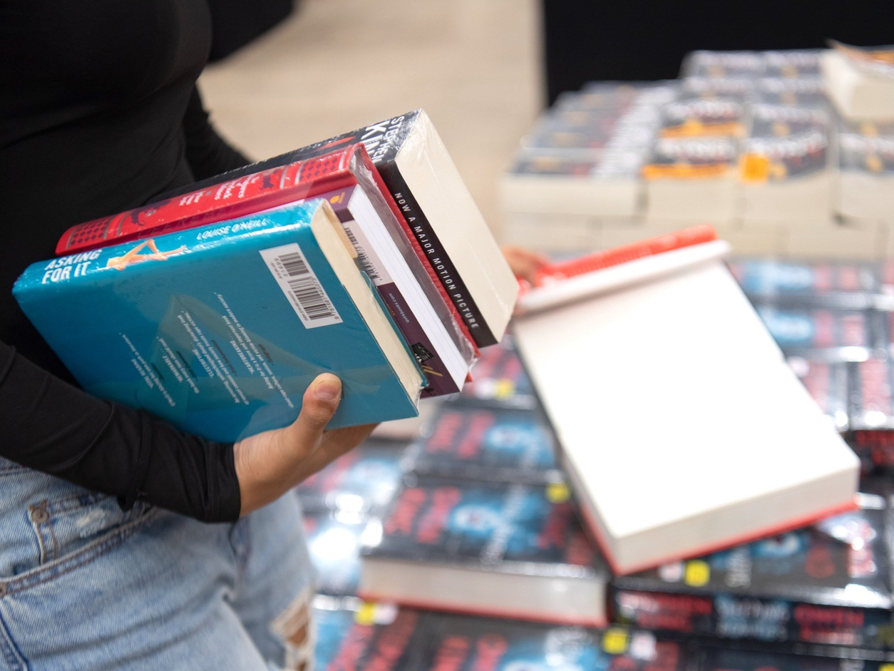 Person Shopping for Books
